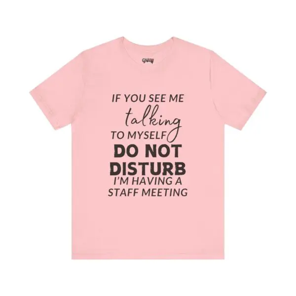 Pink shirt with humorous text design.