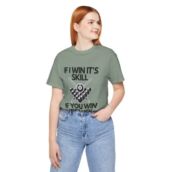 Woman wearing billiards-themed t-shirt, smiling.