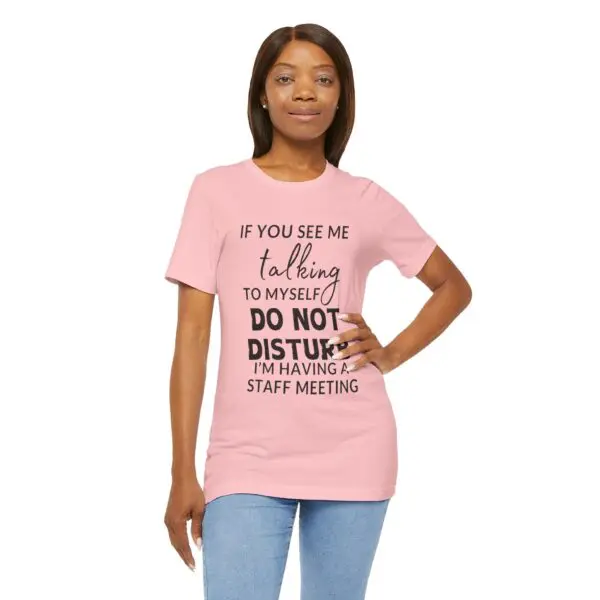 Woman wearing a humorous pink T-shirt.