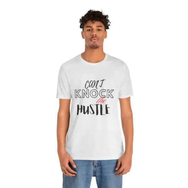 Man wearing "Can't Knock the Hustle" shirt.