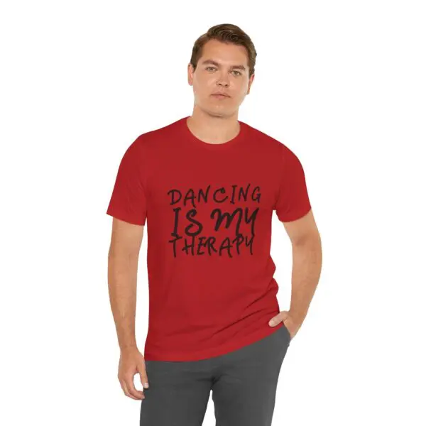 Man wearing "Dancing is My Therapy" shirt.