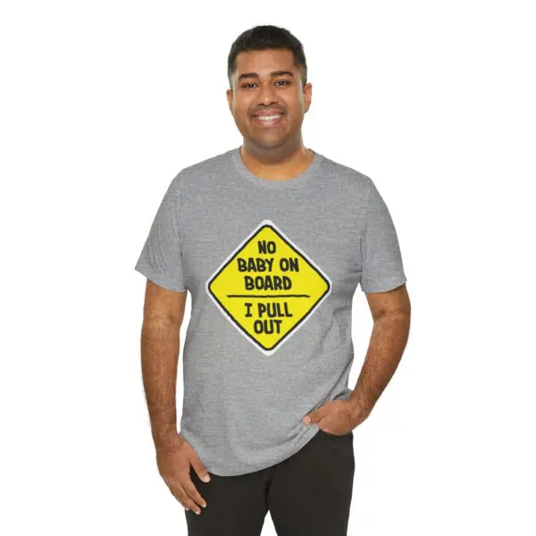 Man wearing humorous graphic t-shirt, smiling.