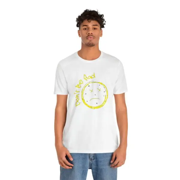 Man wearing white t-shirt with sad face.