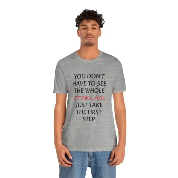 Man wearing motivational quote t-shirt.