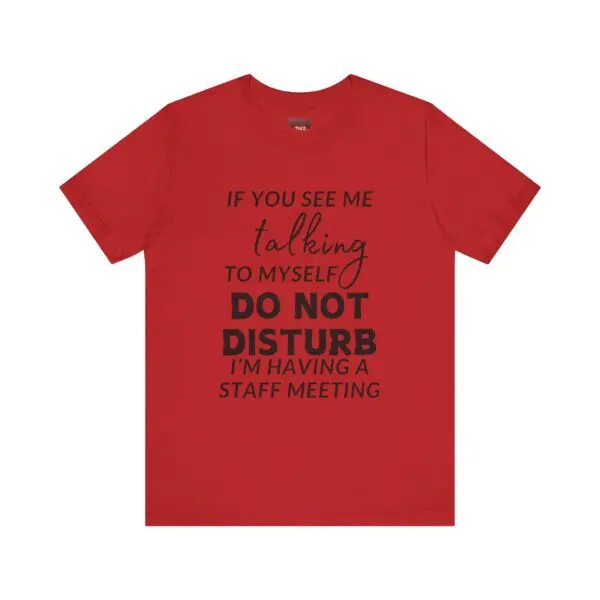 Red T-shirt with humorous text print.