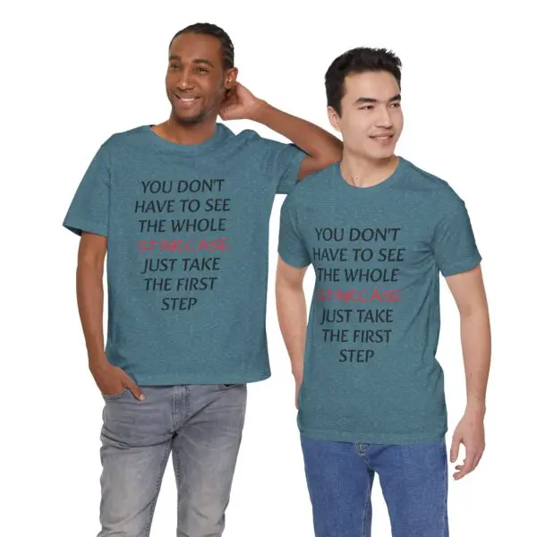 Two men wearing matching motivational shirts.