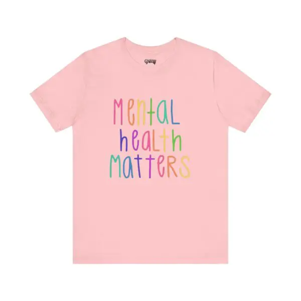 Pink T-shirt with "Mental Health Matters" text.