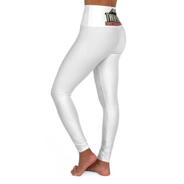 Woman wearing white high-waisted leggings.