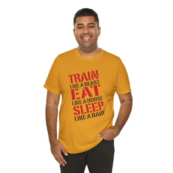 Man wearing motivational slogan t-shirt, smiling.