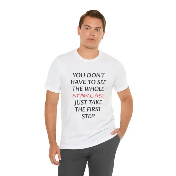 Man wearing motivational quote T-shirt.