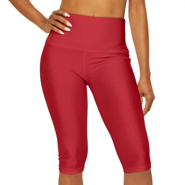 Woman in red high-waisted capri leggings.