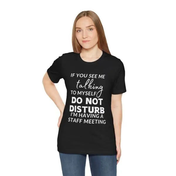 Woman wearing humorous black t-shirt.