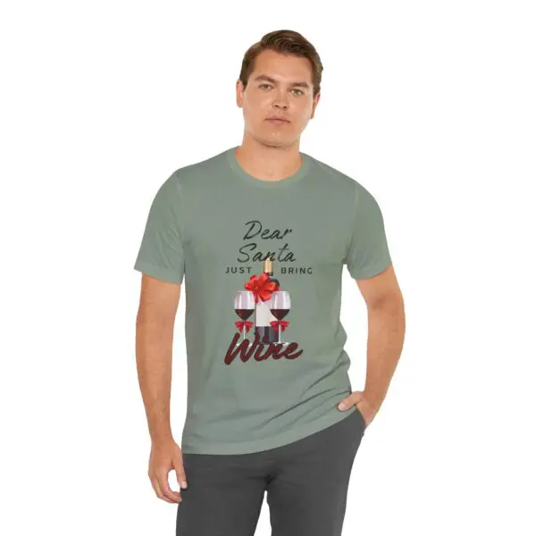 Man wearing "Dear Santa, bring wine" t-shirt.
