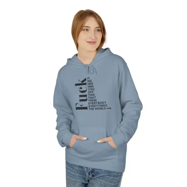 Woman in blue hoodie, hands in pockets.
