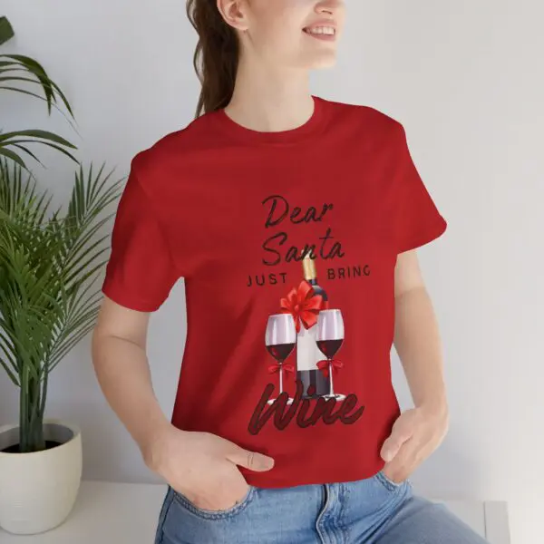 Woman in red shirt with wine design.