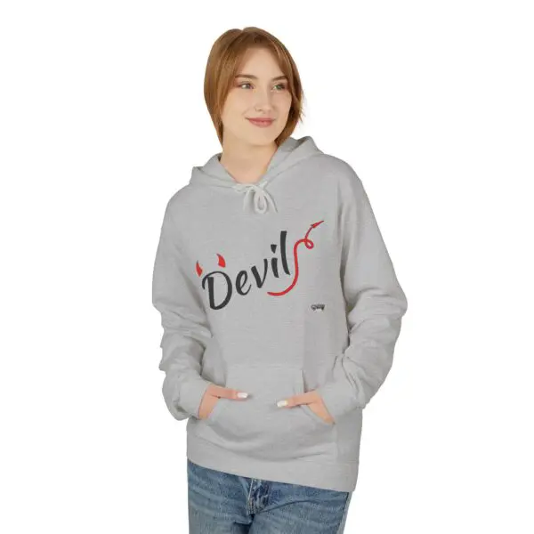 Woman wearing gray "Devils" hoodie, smiling.