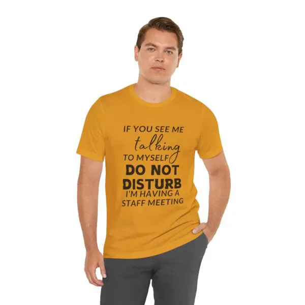 Man wearing a humorous yellow t-shirt.