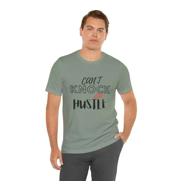 Man wearing "Can't Knock the Hustle" t-shirt.