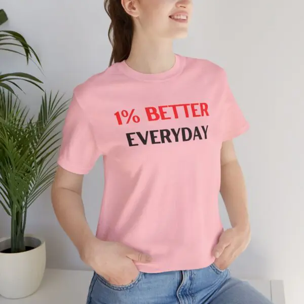 Woman wearing "1% Better Everyday" shirt.