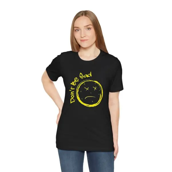 Woman wearing "Don't Be Sad" black T-shirt.