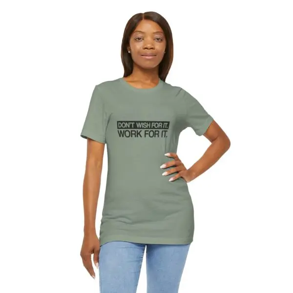 Woman wearing motivational t-shirt, blue jeans.