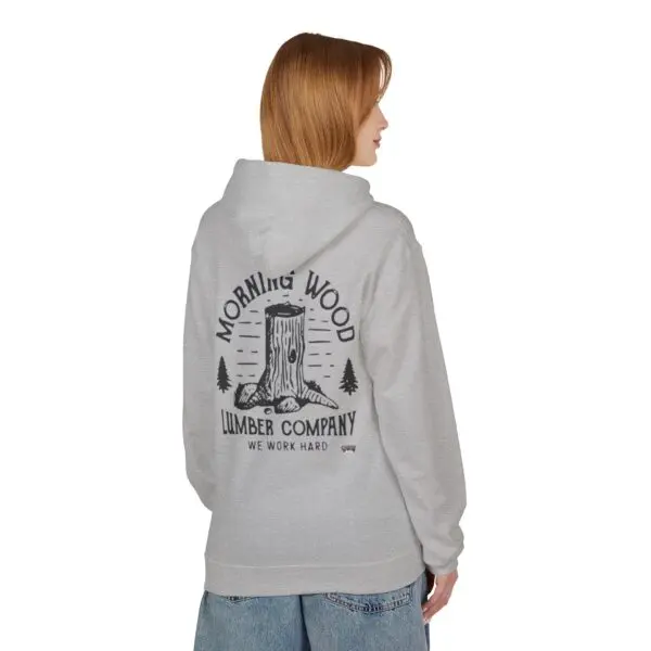Person wearing gray hoodie with tree design.