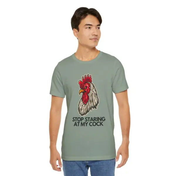 Man wearing rooster graphic t-shirt, humorous text.