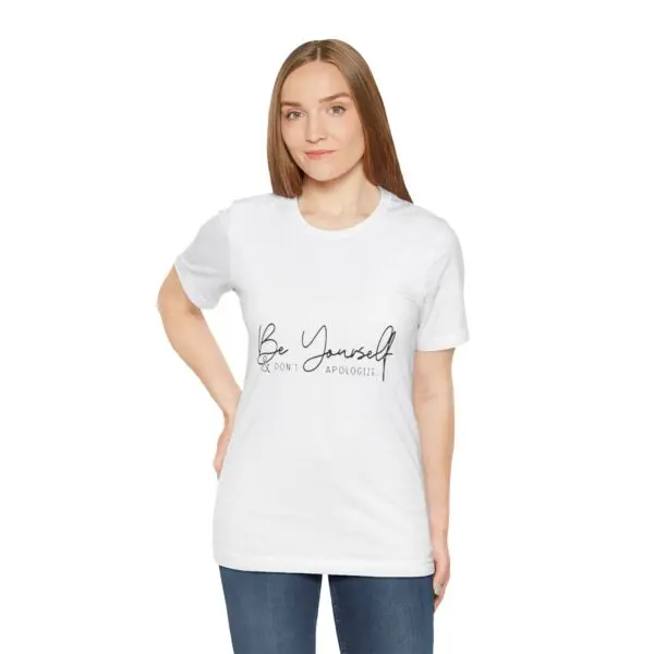 Woman wearing "Be Yourself" white t-shirt.
