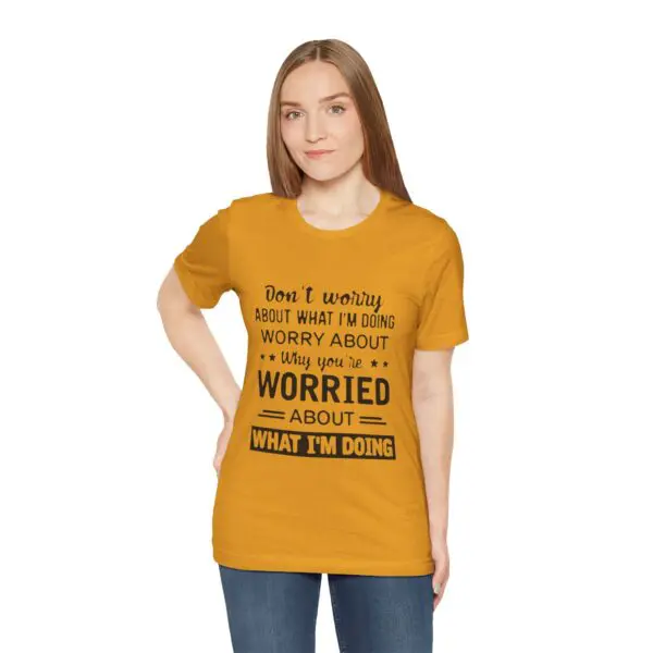 Woman in yellow shirt with printed text.