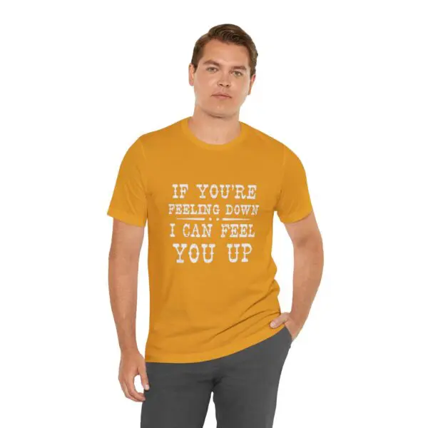 Man wearing yellow shirt with printed text.