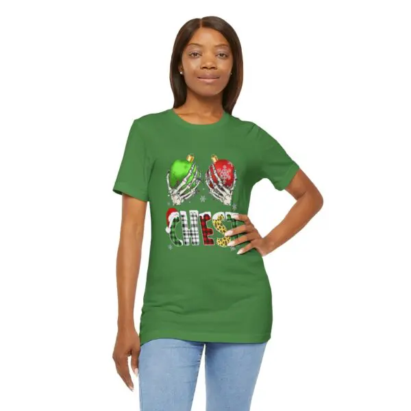 Woman wearing green Christmas-themed t-shirt.