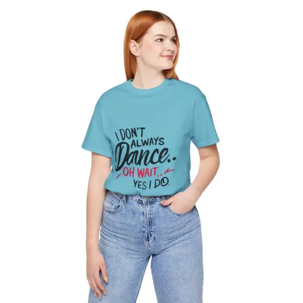 Woman wearing a blue dance-themed t-shirt.