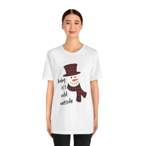 Woman wearing snowman graphic T-shirt.