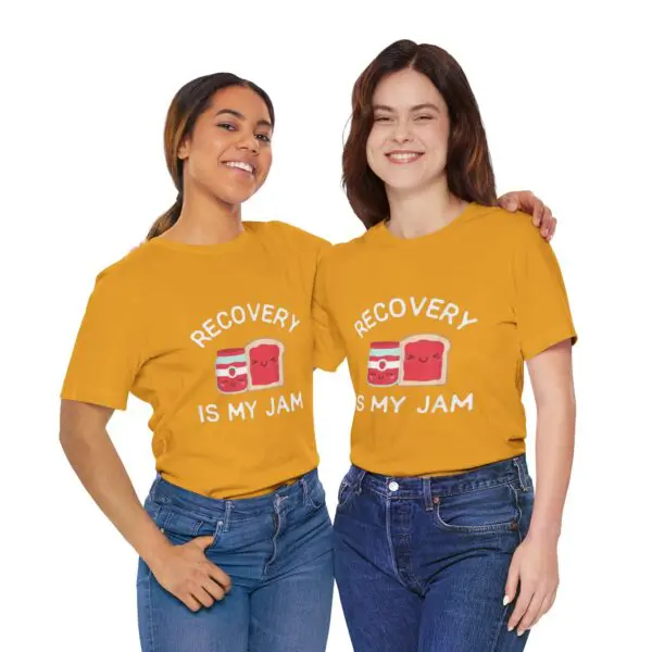 Two women wearing matching graphic t-shirts.