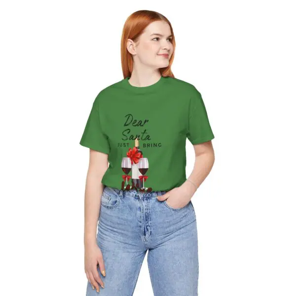 Woman in green festive T-shirt smiling.