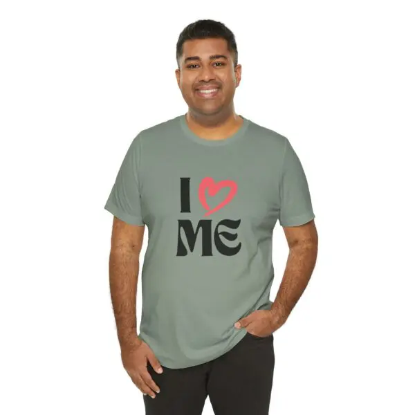 Smiling person in "I Love Me" shirt.