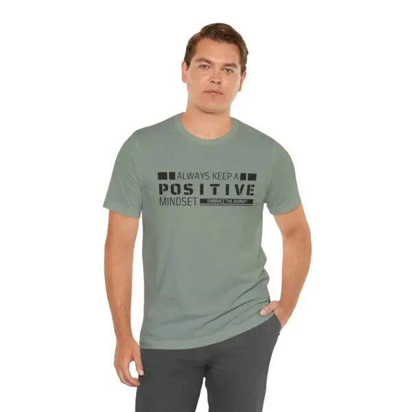 Man wearing "positive mindset" t-shirt.