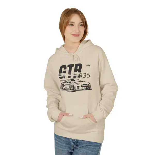 Person wearing hoodie with car graphic design.