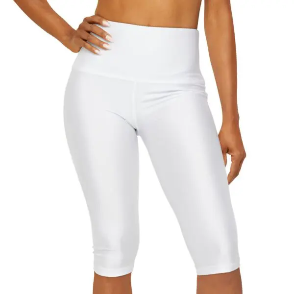 Woman wearing white high-waisted leggings.