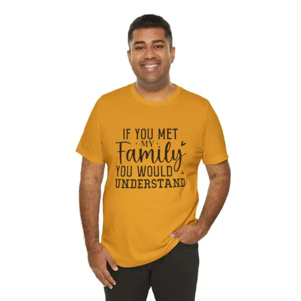 Man wearing yellow shirt with printed text.