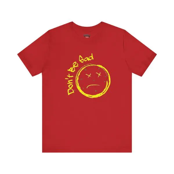 Red shirt with yellow sad face design.