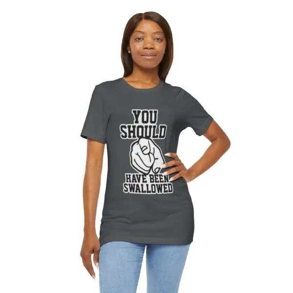 Woman wearing humorous graphic t-shirt, smiling.