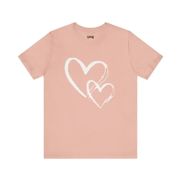 Pink t-shirt with white heart design.