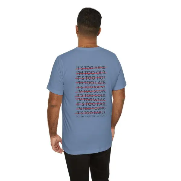 Man wearing motivational text t-shirt.