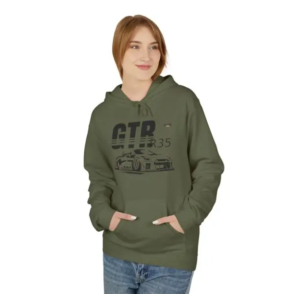 Person wearing green hoodie with car design.