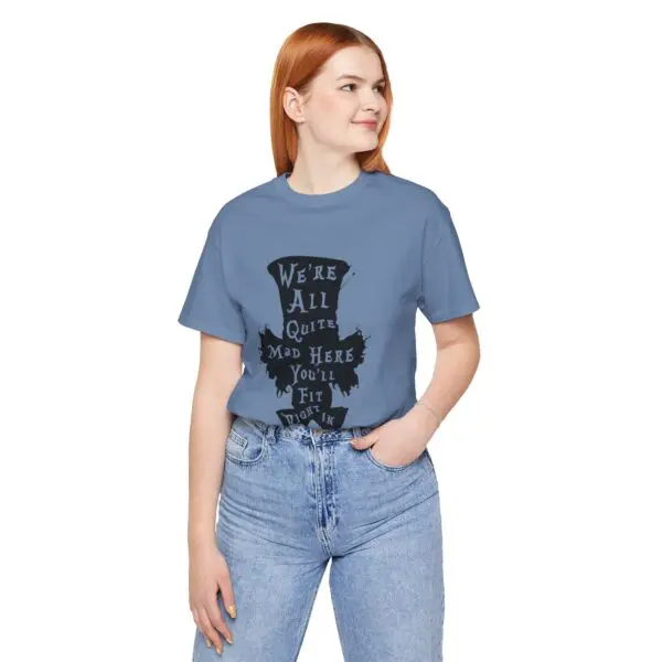 Woman in blue shirt with quirky quote.