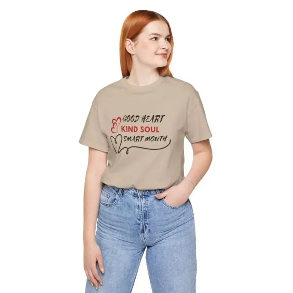 Woman wearing graphic t-shirt and jeans.