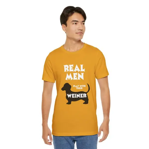 Man wearing humorous yellow dachshund shirt.
