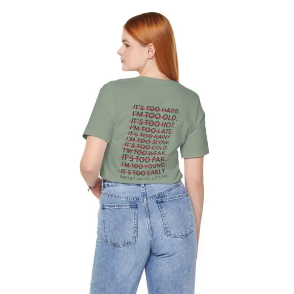 Woman wearing a shirt with printed text.