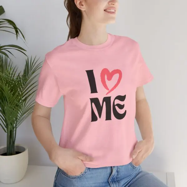 Woman in pink "I Love Me" shirt.